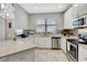 Modern kitchen with stainless steel appliances and granite countertops at 228 Crew Ct, Sarasota, FL 34243