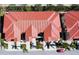 Aerial view of a townhouse building with red tile roofs at 228 Crew Ct, Sarasota, FL 34243