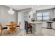 Bright dining area with wood table and chairs, adjacent to kitchen at 228 Crew Ct, Sarasota, FL 34243