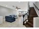 Elegant staircase with dark wood and metal railing at 228 Crew Ct, Sarasota, FL 34243
