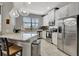 Bright kitchen with island, stainless steel appliances, and granite countertops at 228 Crew Ct, Sarasota, FL 34243
