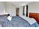 Bedroom with a comfortable bed, wooden dresser, and plenty of light at 228 Crew Ct, Sarasota, FL 34243