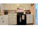 Efficient kitchen with ample counter space and black appliances at 1320 W Corktree Cir, Port Charlotte, FL 33952