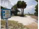 Beach access in the town of Longboat Key with a path leading to the sandy shore at 2850 Gulf Of Mexico Dr # 2, Longboat Key, FL 34228
