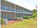 Spacious screened in porch with seating offering outdoor relaxation at 2850 Gulf Of Mexico Dr # 2, Longboat Key, FL 34228