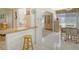 Kitchen flows into dining area with tile flooring at 2020 Riverbluff Pkwy # V329, Sarasota, FL 34231
