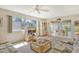 Living room with view into dining room and access to the patio at 2020 Riverbluff Pkwy # V329, Sarasota, FL 34231
