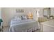 Bright bedroom with a king-size bed and ample closet space at 2020 Riverbluff Pkwy # V329, Sarasota, FL 34231