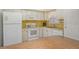 Bright kitchen features ample counter space and white appliances at 2020 Riverbluff Pkwy # V329, Sarasota, FL 34231