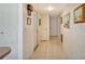 Clean hallway with tile floors and access to other rooms at 2020 Riverbluff Pkwy # V329, Sarasota, FL 34231