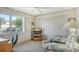 Home office space includes built-in shelving and seating at 2020 Riverbluff Pkwy # V329, Sarasota, FL 34231