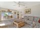 Open living area with a view into the dining room and sliding doors to the patio at 2020 Riverbluff Pkwy # V329, Sarasota, FL 34231