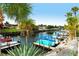 Boats docked at canal, lush landscaping at 2020 Riverbluff Pkwy # V329, Sarasota, FL 34231