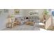 Bright living room with comfy furniture and large windows at 2020 Riverbluff Pkwy # V329, Sarasota, FL 34231