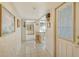 Bright entry hall with tile flooring and views into the living and kitchen areas at 2020 Riverbluff Pkwy # V329, Sarasota, FL 34231