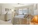 Spacious bedroom with large bed and dresser at 2020 Riverbluff Pkwy # V329, Sarasota, FL 34231