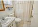 Bathroom with tub shower combination and updated vanity at 2020 Riverbluff Pkwy # V329, Sarasota, FL 34231