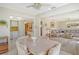 Bright dining area with kitchen access and open living space at 2020 Riverbluff Pkwy # V329, Sarasota, FL 34231