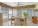Casual dining area with access to the patio and view of the kitchen at 2020 Riverbluff Pkwy # V329, Sarasota, FL 34231