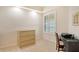 Home office features a desk, chair, and file cabinet, with a window offering natural light at 10520 Boardwalk Loop # 301, Bradenton, FL 34202