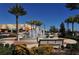 Scenic town square with water fountain, benches, and palm trees at 10520 Boardwalk Loop # 301, Bradenton, FL 34202
