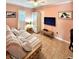 Relaxing bedroom featuring a sleeper sofa and a large TV at 2850 Gulf Of Mexico Dr # 2, Longboat Key, FL 34228