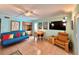 Bright living room with comfy seating, a TV, and a dining area at 2850 Gulf Of Mexico Dr # 2, Longboat Key, FL 34228