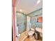 Accessible bathroom with walk-in shower and mosaic tile at 2850 Gulf Of Mexico Dr # 2, Longboat Key, FL 34228