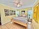 King-size bed in a sunny bedroom with light-colored walls at 2850 Gulf Of Mexico Dr # 2, Longboat Key, FL 34228