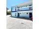 Light blue building with white balcony and multiple entrances at 2850 Gulf Of Mexico Dr # 2, Longboat Key, FL 34228
