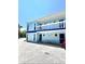 Two-story light blue building with balconies at 2850 Gulf Of Mexico Dr # 2, Longboat Key, FL 34228