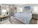 King-size bed, private balcony, and ensuite bathroom at 408 Cerromar S Cir # 130, Venice, FL 34293
