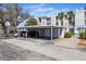 Covered parking with carport for multiple vehicles at 408 Cerromar S Cir # 130, Venice, FL 34293