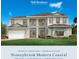 Two-story home with light beige siding, gray roof and balcony at 2477 Waterfront Cir, Sarasota, FL 34240