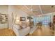 Bright living room with vaulted ceilings, hardwood floors, and access to a patio at 328 Woods Point Rd, Osprey, FL 34229