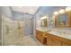 Spa-like bathroom with double sinks, walk-in shower, and tiled floor at 328 Woods Point Rd, Osprey, FL 34229