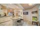 Kitchen island with granite countertop and breakfast bar seating for two at 328 Woods Point Rd, Osprey, FL 34229