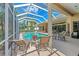 Relaxing pool area with covered patio, lounge chairs, and outdoor seating at 7642 Tralee Way, Bradenton, FL 34202