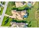 Aerial view of the home, featuring a private pool and beautifully landscaped backyard at 1111 143Rd Ne St, Bradenton, FL 34212