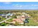 An aerial view showcasing the neighborhood's beautiful homes, landscaping, and lake views at 1111 143Rd Ne St, Bradenton, FL 34212