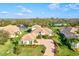 Beautifully landscaped home featuring a paver driveway, mature trees, and well-manicured lawn in desirable neighborhood at 1111 143Rd Ne St, Bradenton, FL 34212