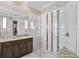 This contemporary bathroom features an expansive glass shower with decorative tile accents at 1111 143Rd Ne St, Bradenton, FL 34212