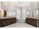 Luxurious bathroom with a large soaking tub and double vanity at 1111 143Rd Ne St, Bradenton, FL 34212