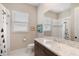 This traditional bathroom offers a marble countertop, vanity, and a shower-tub combination at 1111 143Rd Ne St, Bradenton, FL 34212