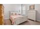 Cozy guest bedroom with a comfortable bed and neutral decor at 1111 143Rd Ne St, Bradenton, FL 34212