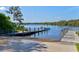 Community boat dock on calm waters with a person getting on a boat at 1111 143Rd Ne St, Bradenton, FL 34212