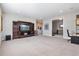 Open bonus room with a large entertainment center and flexible living space at 1111 143Rd Ne St, Bradenton, FL 34212