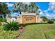 Beautiful Winding River community sign, featuring lush landscaping and mature palm trees against a clear blue sky at 1111 143Rd Ne St, Bradenton, FL 34212