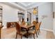 Elegant dining room features a large table and hardwood floors at 1111 143Rd Ne St, Bradenton, FL 34212