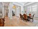 Bright dining area with large windows and stylish lighting fixtures at 1111 143Rd Ne St, Bradenton, FL 34212